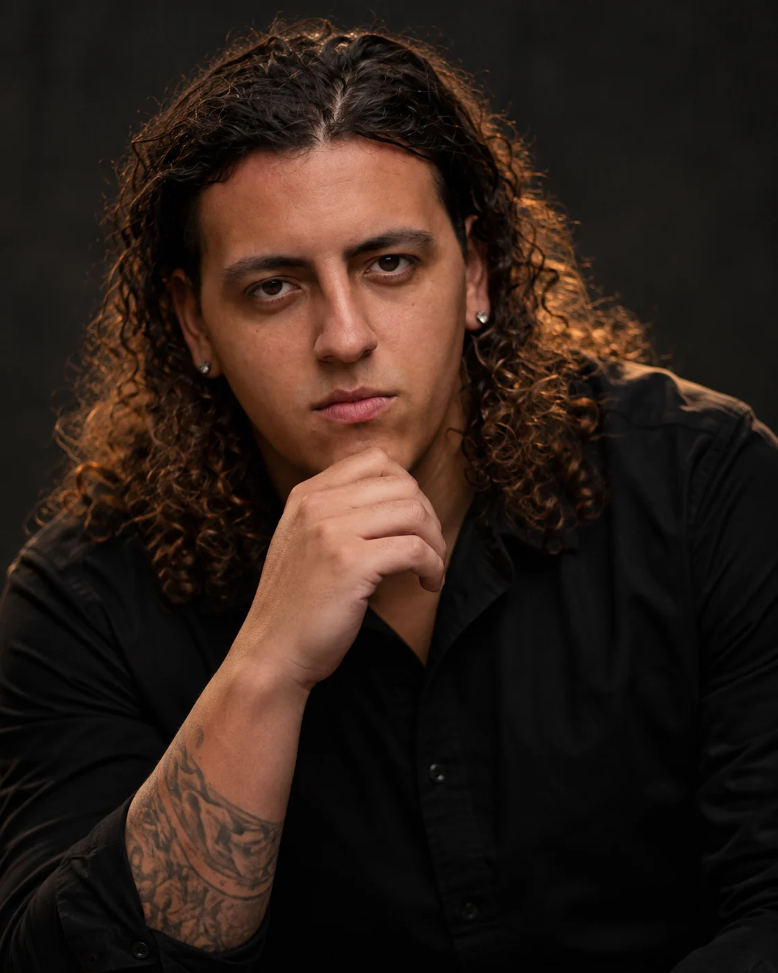 Julian Johnson, founder of JPAX Media, chin resting on his hand